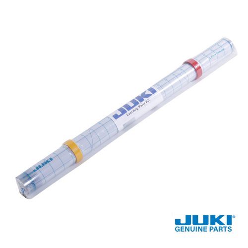 Juki learning ruler set for longarm machines, shown rolled up like a tube for storage, authentic Juki quilting accessory.
