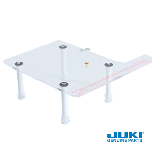 Juki serger extension table set with clear acrylic top and adjustable legs, designed to expand the workspace, support larger projects, and store accessories underneath