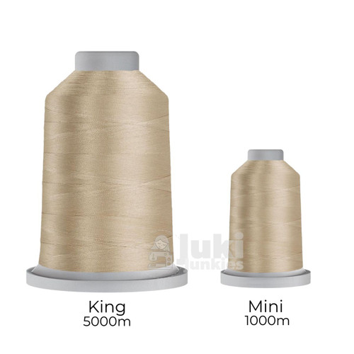 Close-up of two spools of Glide 40 weight polyester thread in Cashmere: a large King spool (5,500 yards) and a smaller Mini spool (1,100 yards), shown side by side for size comparison, with a smooth texture and noticeable sheen.
