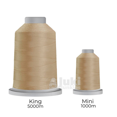 Close-up of two spools of Glide 40 weight polyester thread in Pearl: a large King spool (5,500 yards) and a smaller Mini spool (1,100 yards), shown side by side for size comparison, with a smooth texture and noticeable sheen.