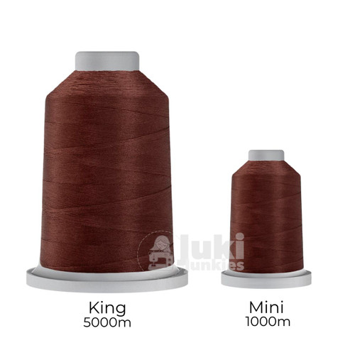 Close-up of two spools of Glide 40 weight polyester thread in Auburn: a large King spool (5,500 yards) and a smaller Mini spool (1,100 yards), shown side by side for size comparison, with a smooth texture and noticeable sheen.