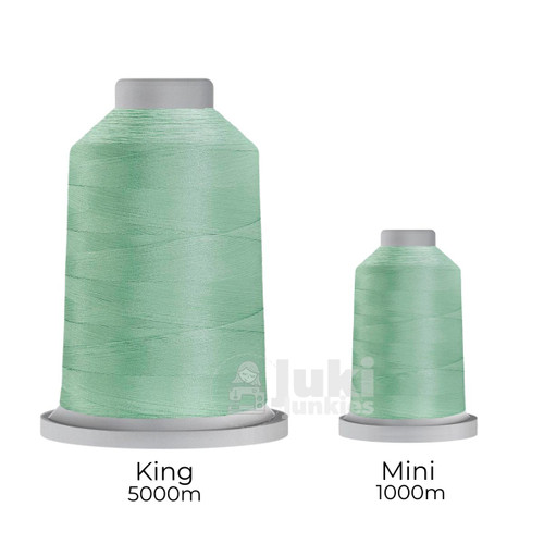 Close-up of two spools of Glide 40 weight polyester thread in Magic Mint: a large King spool (5,500 yards) and a smaller Mini spool (1,100 yards), shown side by side for size comparison, with a smooth texture and noticeable sheen.