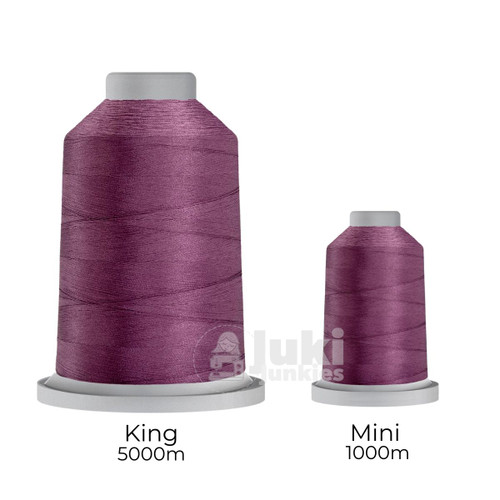 Close-up of two spools of Glide 40 weight polyester thread in Mulberry: a large King spool (5,500 yards) and a smaller Mini spool (1,100 yards), shown side by side for size comparison, with a smooth texture and noticeable sheen.