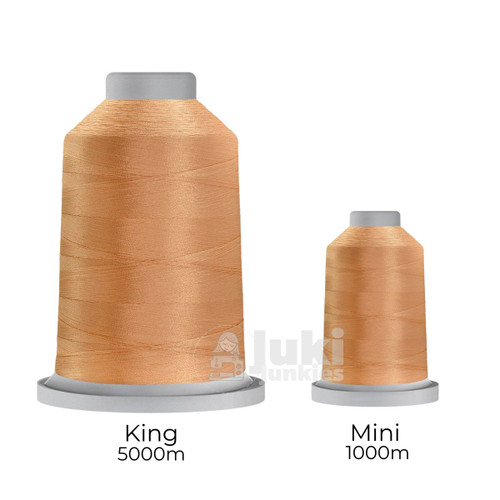 Close-up of two spools of Glide 40 weight polyester thread in Strawberry Blonde: a large King spool (5,500 yards) and a smaller Mini spool (1,100 yards), shown side by side for size comparison, with a smooth texture and noticeable sheen.