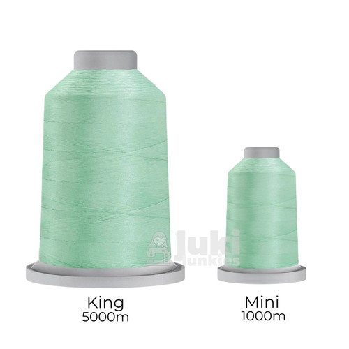 Close-up of two spools of Glide 40 weight polyester thread in Mint Julep: a large King spool (5,500 yards) and a smaller Mini spool (1,100 yards), shown side by side for size comparison, with a smooth texture and noticeable sheen.