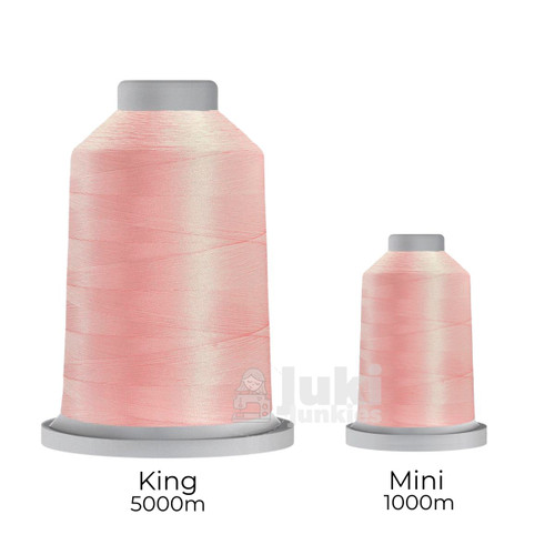 Close-up of two spools of Glide 40 weight polyester thread in Cotton Candy: a large King spool (5,500 yards) and a smaller Mini spool (1,100 yards), shown side by side for size comparison, with a smooth texture and noticeable sheen.