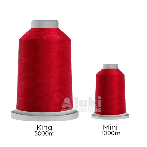 Close-up of two spools of Glide 40 weight polyester thread in Wildflower: a large King spool (5,500 yards) and a smaller Mini spool (1,100 yards), shown side by side for size comparison, with a smooth texture and noticeable sheen.