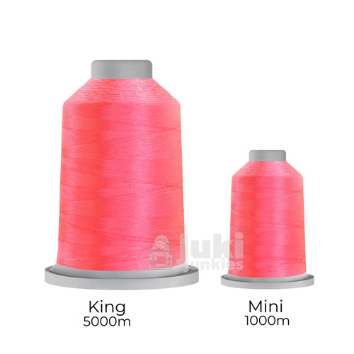 Close-up of two spools of Glide 40 weight polyester thread in Hope: a large King spool (5,500 yards) and a smaller Mini spool (1,100 yards), shown side by side for size comparison, with a smooth texture and noticeable sheen.