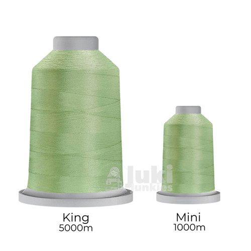 Close-up of two spools of Glide 40 weight polyester thread in Sea Foam: a large King spool (5,500 yards) and a smaller Mini spool (1,100 yards), shown side by side for size comparison, with a smooth texture and noticeable sheen.