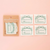all four organic cotton labels labels next to cardboard packaging
