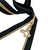 The gold bow zipper pull on a zipper