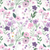 Close up of fabric with a variety of pink and purple flowers on a white background