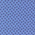 Close up of fabric with an abstract blue polka dot pattern with a light blue background