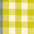 Close up of towel fabric with a white and yellow colored gingham pattern and blue stripe on the side