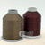 Close up of chocolate brown and burgundy colored thread spools