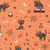 Close up of fabric with black cats, bones, spiderwebs, spiders, candles, and stars on an orange background