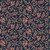 Close up of fabric with colorful leaves on a dark navy background
