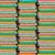 Close up image of fabric with various textbooks stacked on a black background
