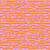 Close up of fabric with pink erasers on an orange and yellow striped bakcground