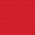 Close up of fabric with red holiday bells on a red background with red polka dots
