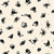 Close up of fabric with black spiders and small orange spiders on a cream colored background