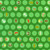 Close up of fabric with light green polka dots and various Grinch characters and holiday related items on a dark green background