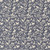 Close up of fabric with small white birds and leaves on a navy background