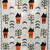 Close up of quilt pattern with bats, trees, and spooky houses