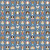 Close up of fabric with various dog portraits on a blue-gray colored background