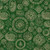 Close up of fabric with various holiday stamps on a dark green background