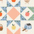 Close up of fabric with a star pattern and various types of apples and farm animals on a cream colored background