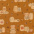 Close up of fabric with decorated pumpkins and florals on a caramel brown colored background