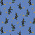 Close up of fabric with witches on brooms and moons on a muted blue background
