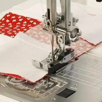 Close up of the &frac14;&Prime; seam foot with guide