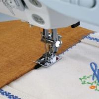 Close up of the ditch quilting foot in action