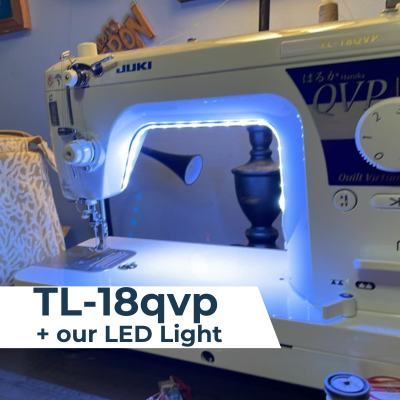 A Juki TL-18QVP sewing machine with an illuminated Juki Junkies LED light strip installed under the throat.