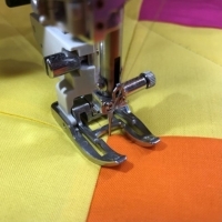 Close-up of the AcuFeed Dual Feed Open Toe Foot UD