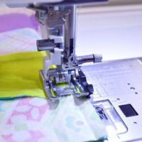close up of the AcuFeed quilt piecing foot in action