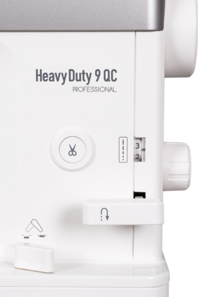 Side view of the Janome HD9 QCP showing the built-in drop feed lever and thread cutter.