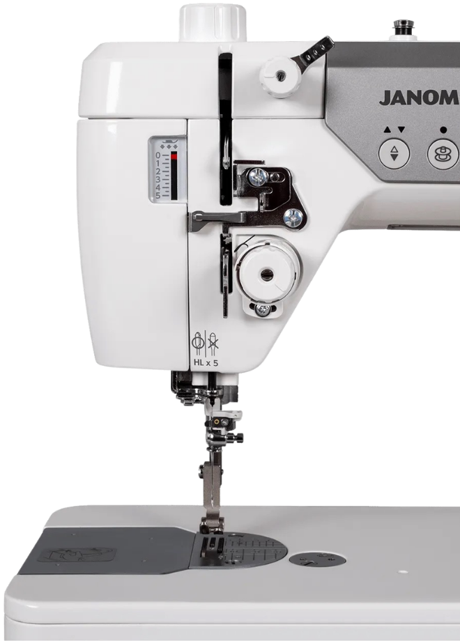 Close-up of the Janome HD9 QCP needle area, presser foot, and bobbin winder.