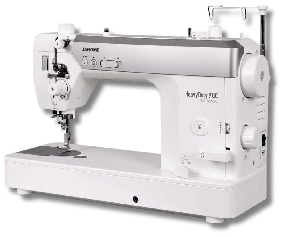 Janome HD9 QCP sewing machine on a wood table with the Janome Junkies logo below it.