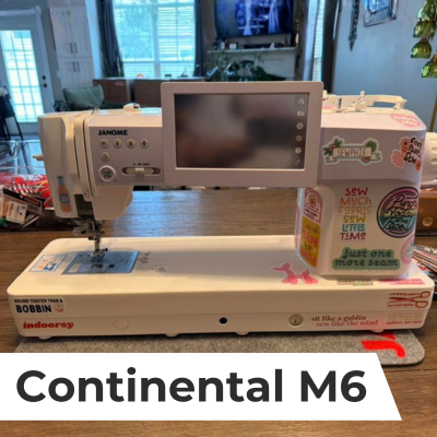 A lifestyle shot of a customer's Janome Continental M6 sewing machine customized with decals.