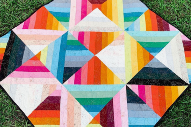Free motion quilt design on a colorful quilt using the Juki TL-18QVP