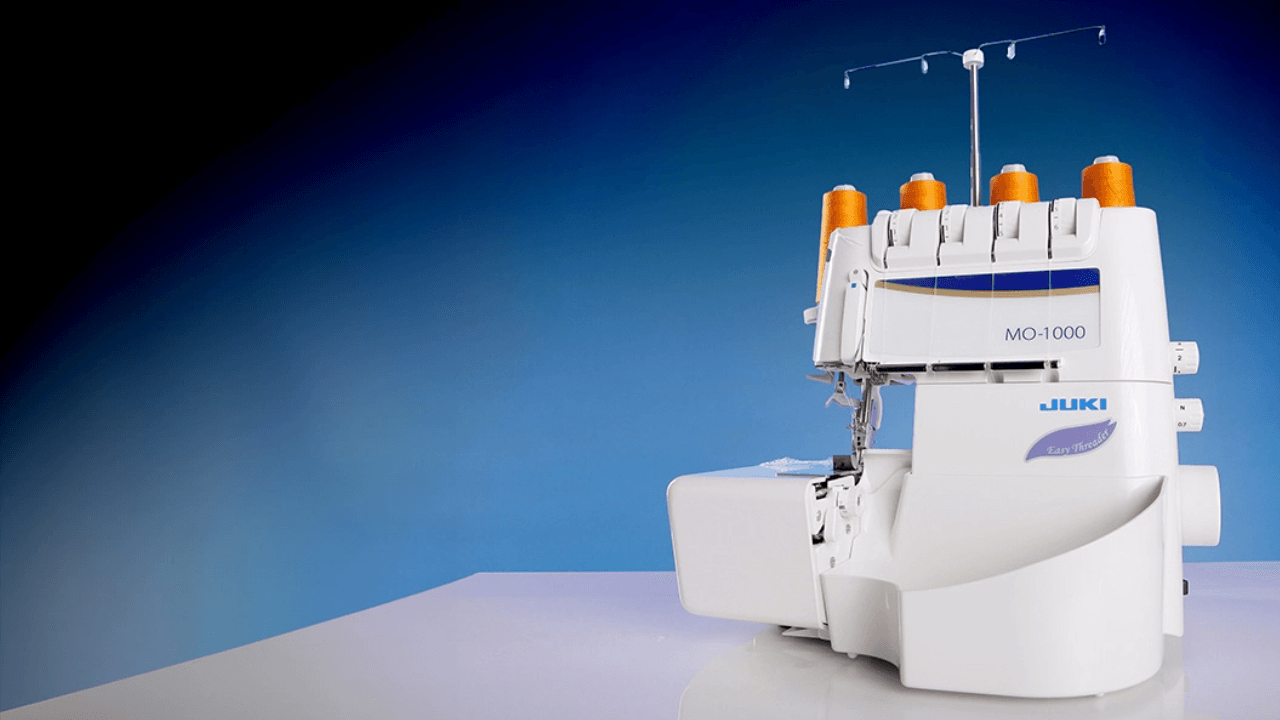Juki MO-1000 Air Threading Serger with Orange Thread Spools