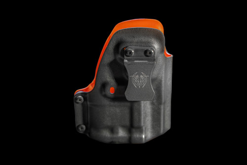 Close-up front view of the RXM Reaper Holster featuring a durable black Kydex construction, precision molded retention, adjustable belt clip, and high-visibility orange interior. Designed specifically for secure carry and quick access with the JL Billet RXM Reaper chassis system.