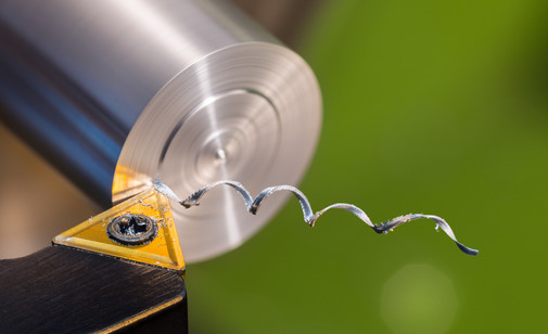 An aluminum rod is milled in a cnc machine.