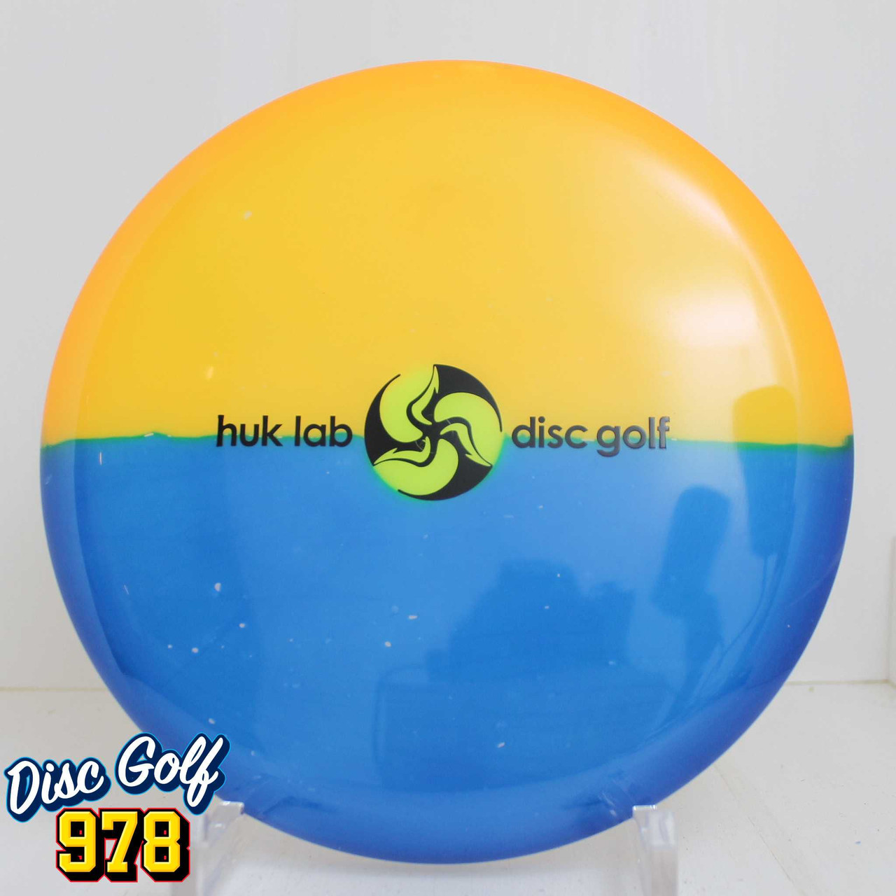 Latitude 64 Pure Opto - Huk Bar CM Dyes 176.8g Orange/Blue