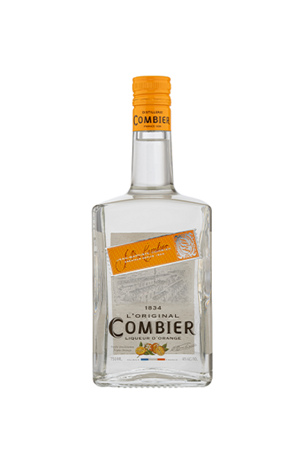 bottle of Combier Orange, liqueur is clear in color