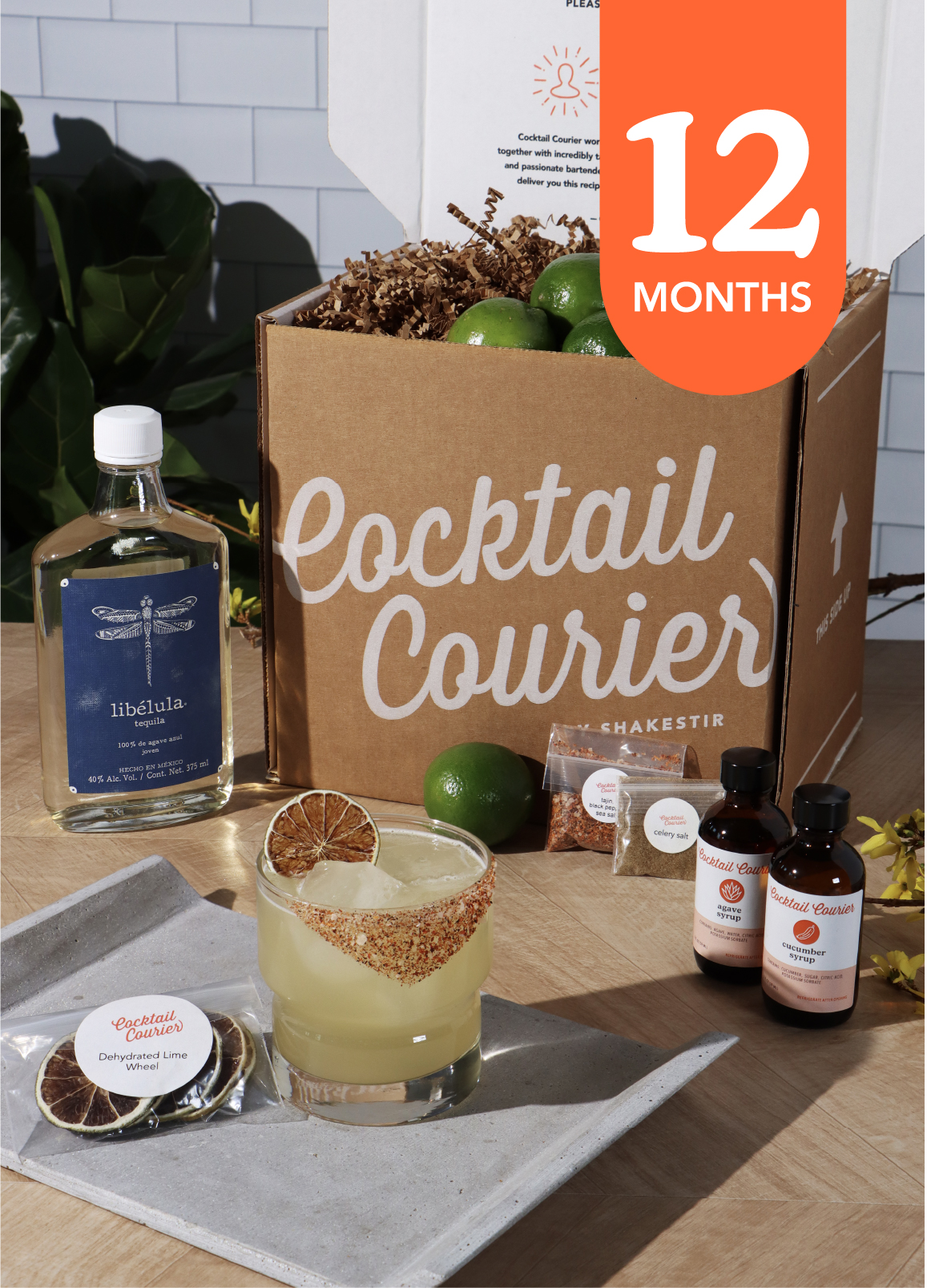 Cocktail box with tequila and syrups and lemon with a refreshing looking cocktail and text with a 12month referring to the choice.