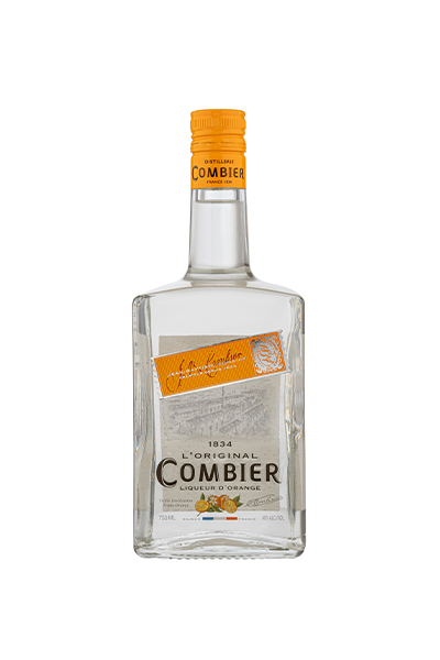 bottle of Combier Orange, liqueur is clear in color